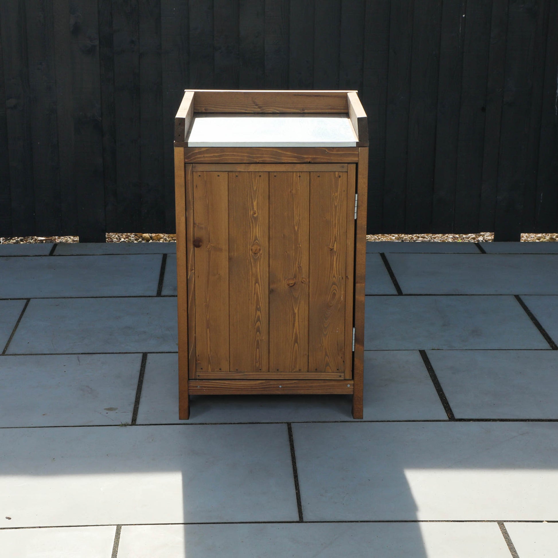 A cabinet from a timber outdoor kitchen