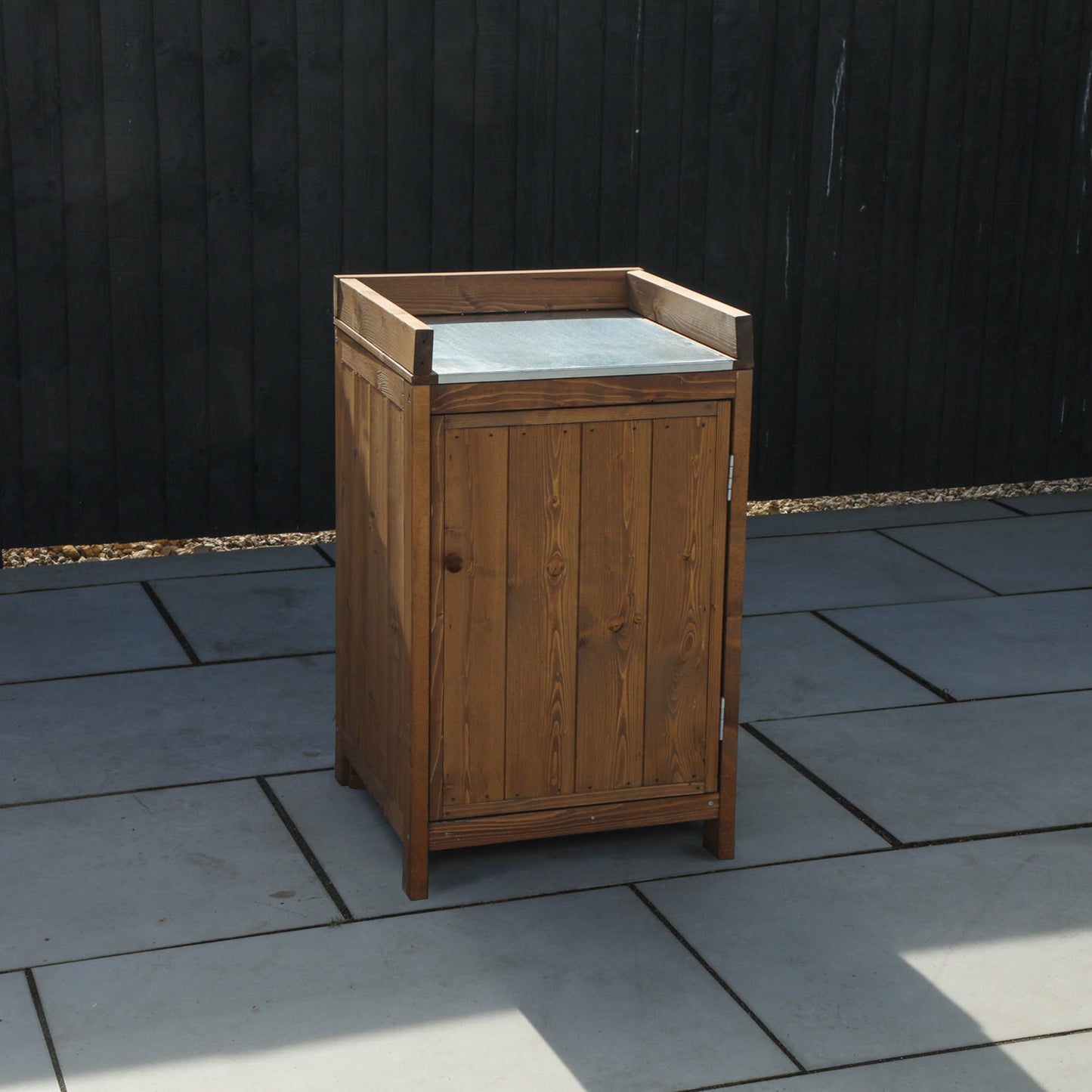 A cabinet from a timber outdoor kitchen