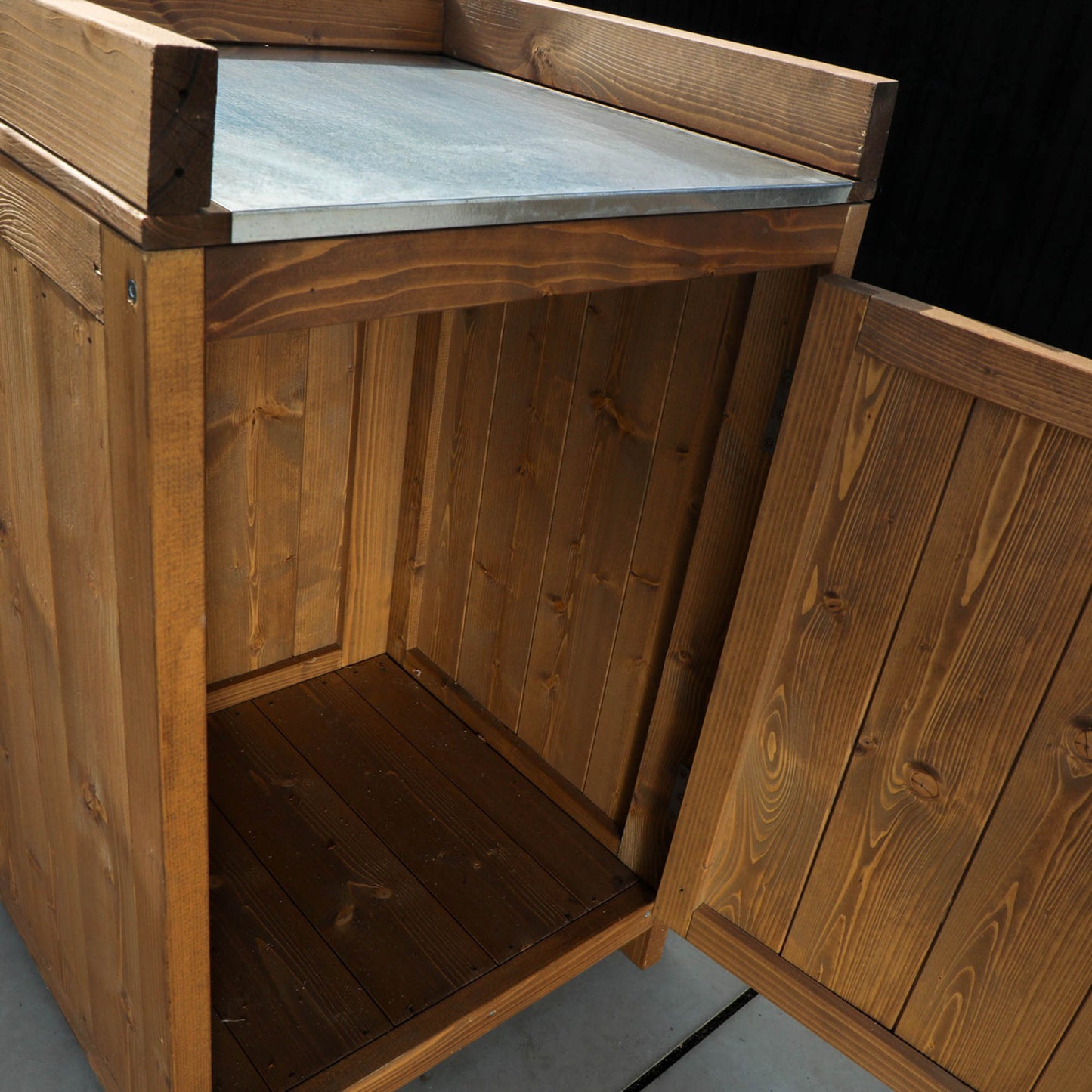 A cabinet from a timber outdoor kitchen