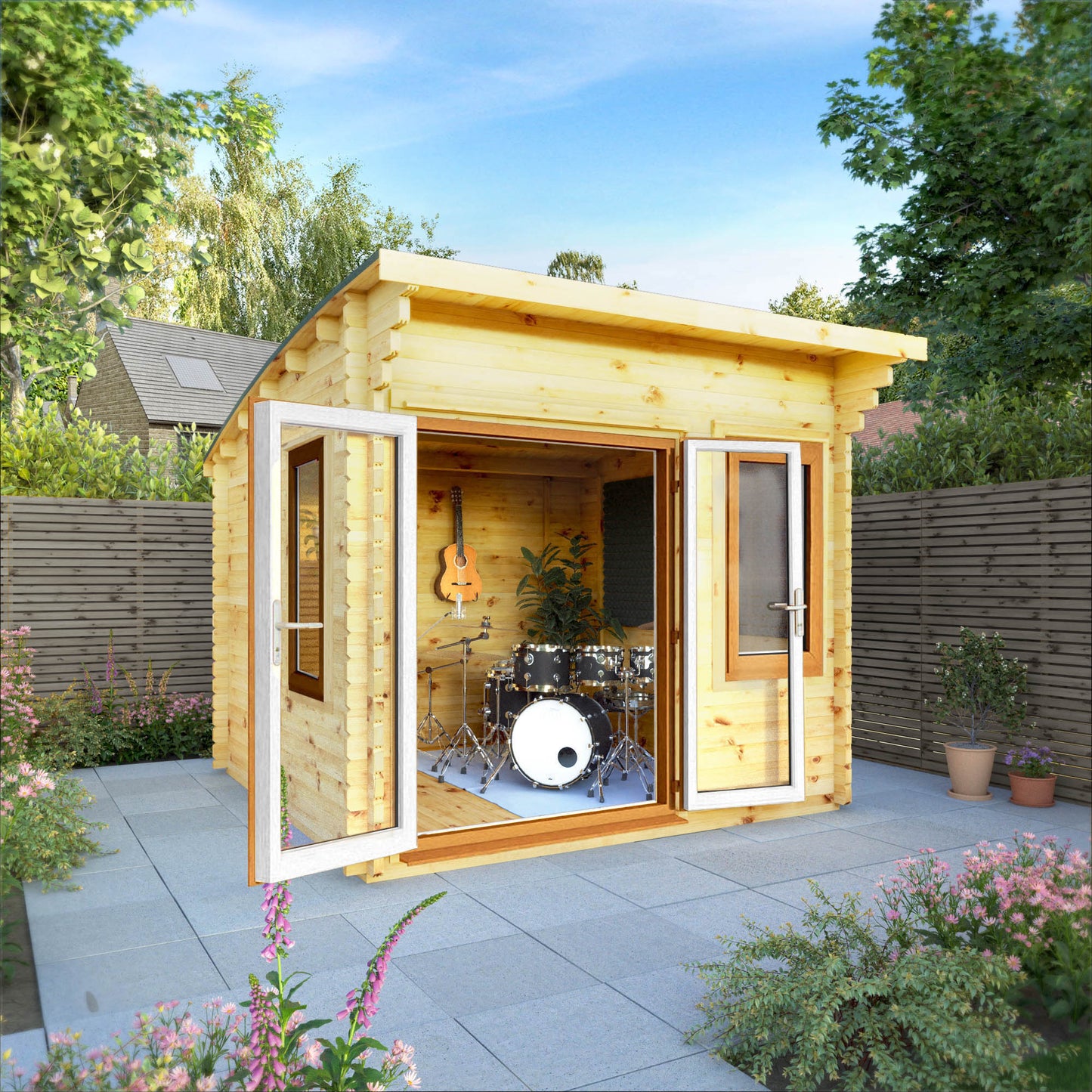 A curved roof log cabin with full length double doors and large windows, being used as a music room in a flowery British garden with oak UPVC