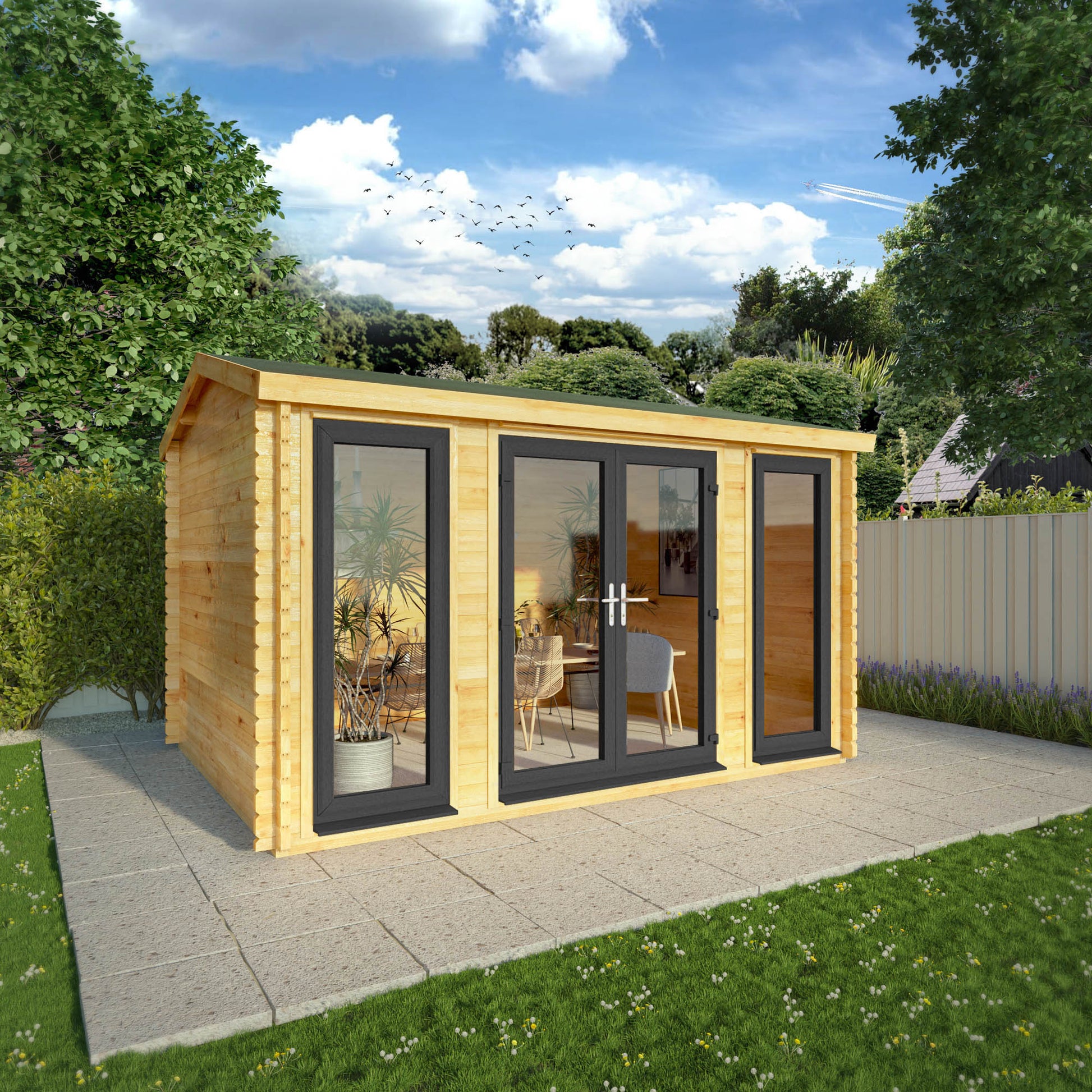 A modern timber log cabin with pent roof, full length windows, double doors in grey UPVC being used as a dining room