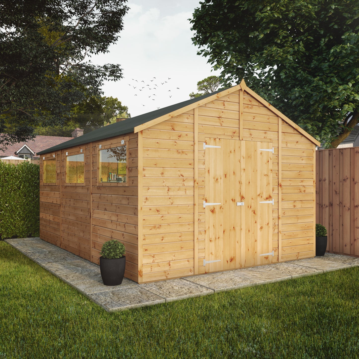 A large timber workshop with double doors, apex roof and windows