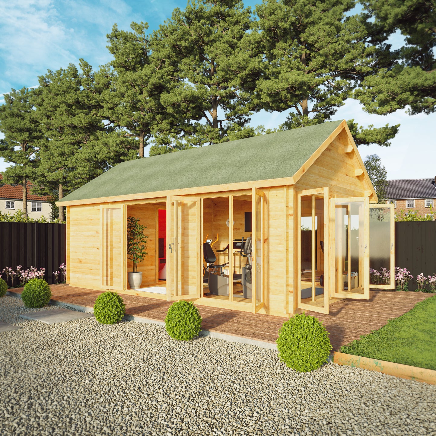 Large timber log cabin, with apex roof, full length windows, double doors in a modern garden. Being used as a home gym and computer gaming room.