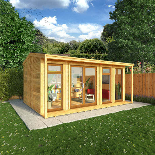 An insulated garden room with an apex roof and full length oak UPVC windows being used as a relaxing room